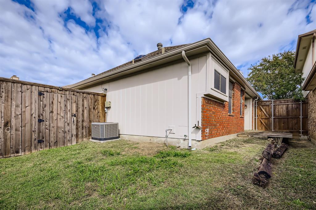 4319 Harvest Hill Road Carrollton, TX 75010 - Photo 28 of 28 View of side of home featuring a fenced backyard and a central AC unit