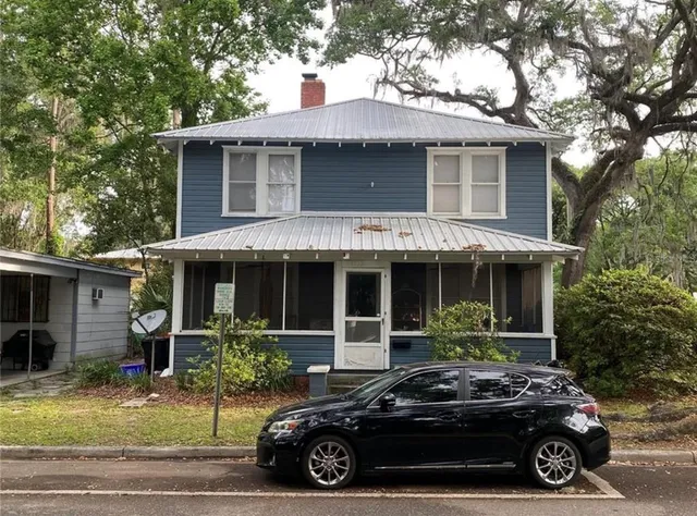 a car parked in front of a house