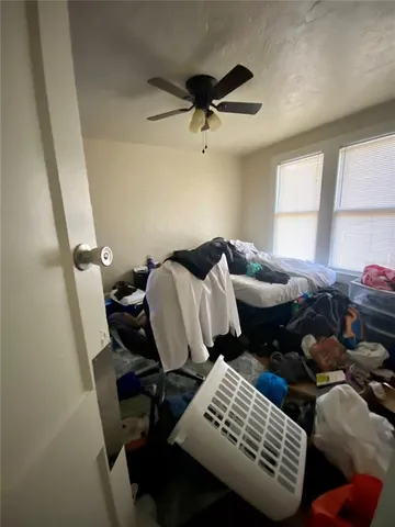 a bedroom with furniture and a window
