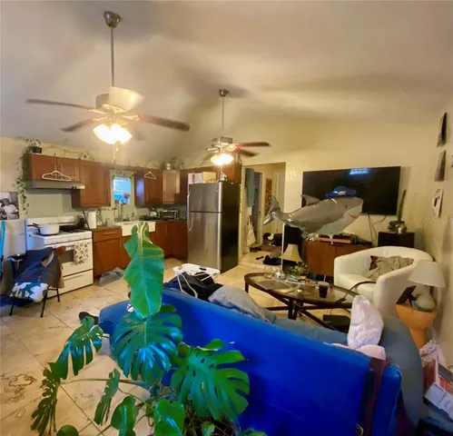 a view of a workspace with furniture and a chandelier