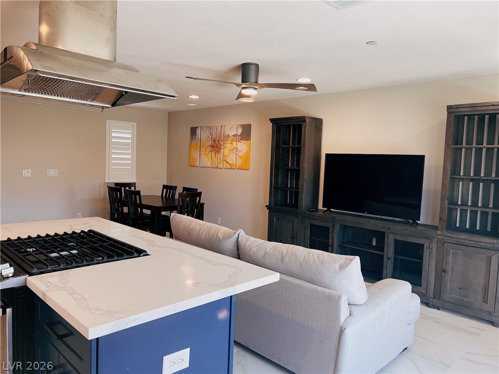 4631 Amazing View Street Las Vegas, NV 89129 - Photo 29 of 33 An open concept design seamlessly connects the kitchen, dining area, and living room.