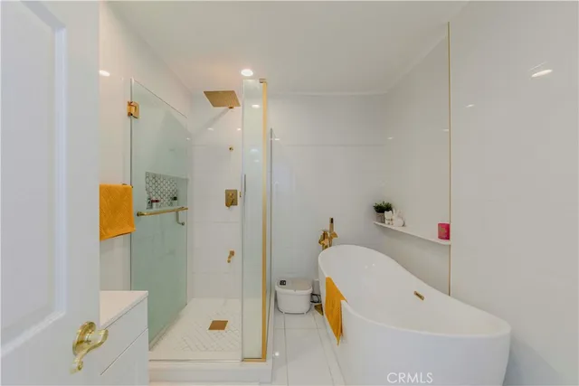 a bathroom with a tub and shower