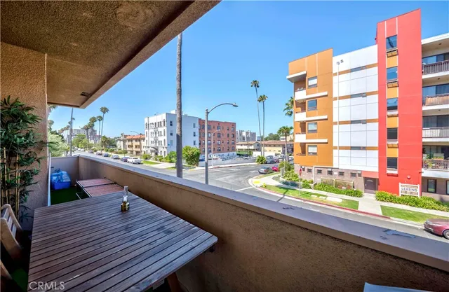 a balcony with lots of wooden floor and outdoor space