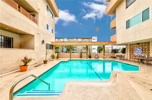 a view of a swimming pool with a patio
