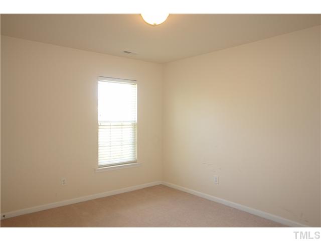 7734 San Gabriel Street Raleigh, NC 27613 - Photo 15 of 25 a view of an empty room and window