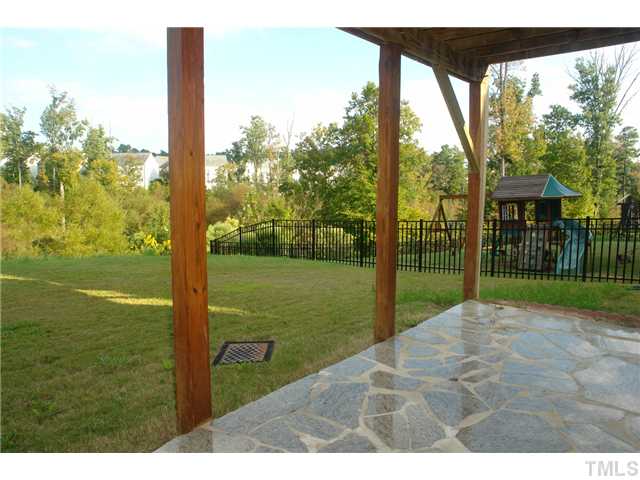 7734 San Gabriel Street Raleigh, NC 27613 - Photo 23 of 25 a view of a porch with a yard