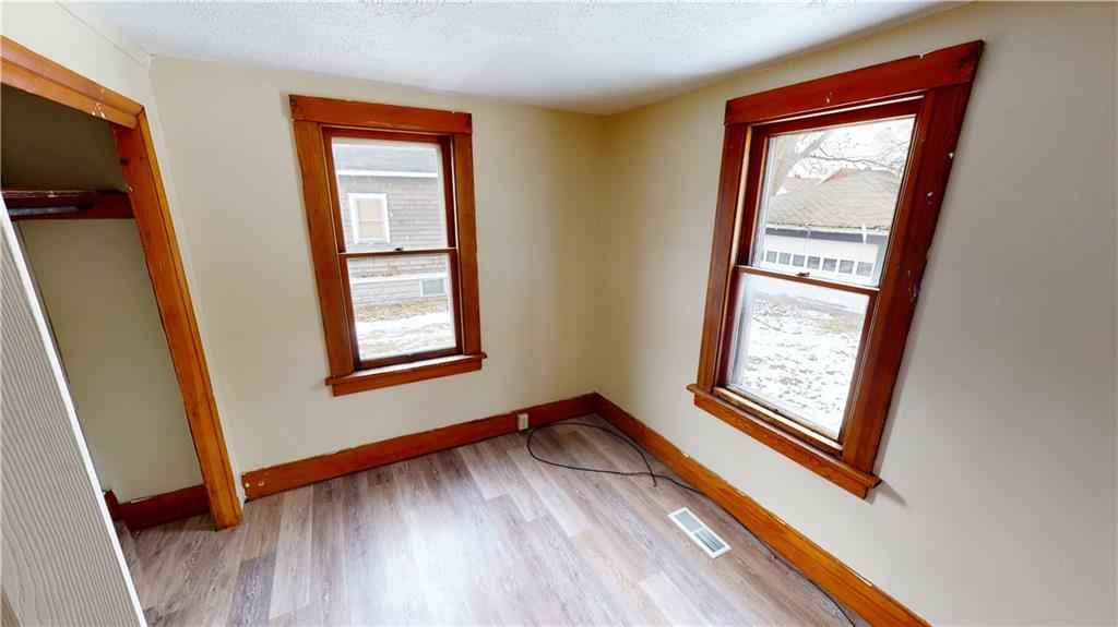 1112 Webster Street Farrell, PA 16121 - Photo 16 of 20 a view of an empty room with wooden floor and a window