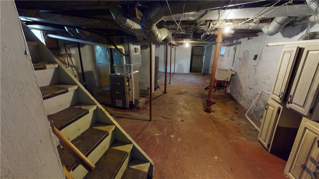 1112 Webster Street Farrell, PA 16121 - Photo 17 of 20 a view of an empty room with wooden floor