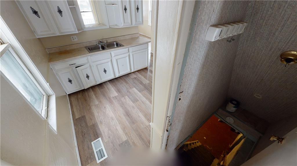 1112 Webster Street Farrell, PA 16121 - Photo 8 of 20 a utility room with cabinets