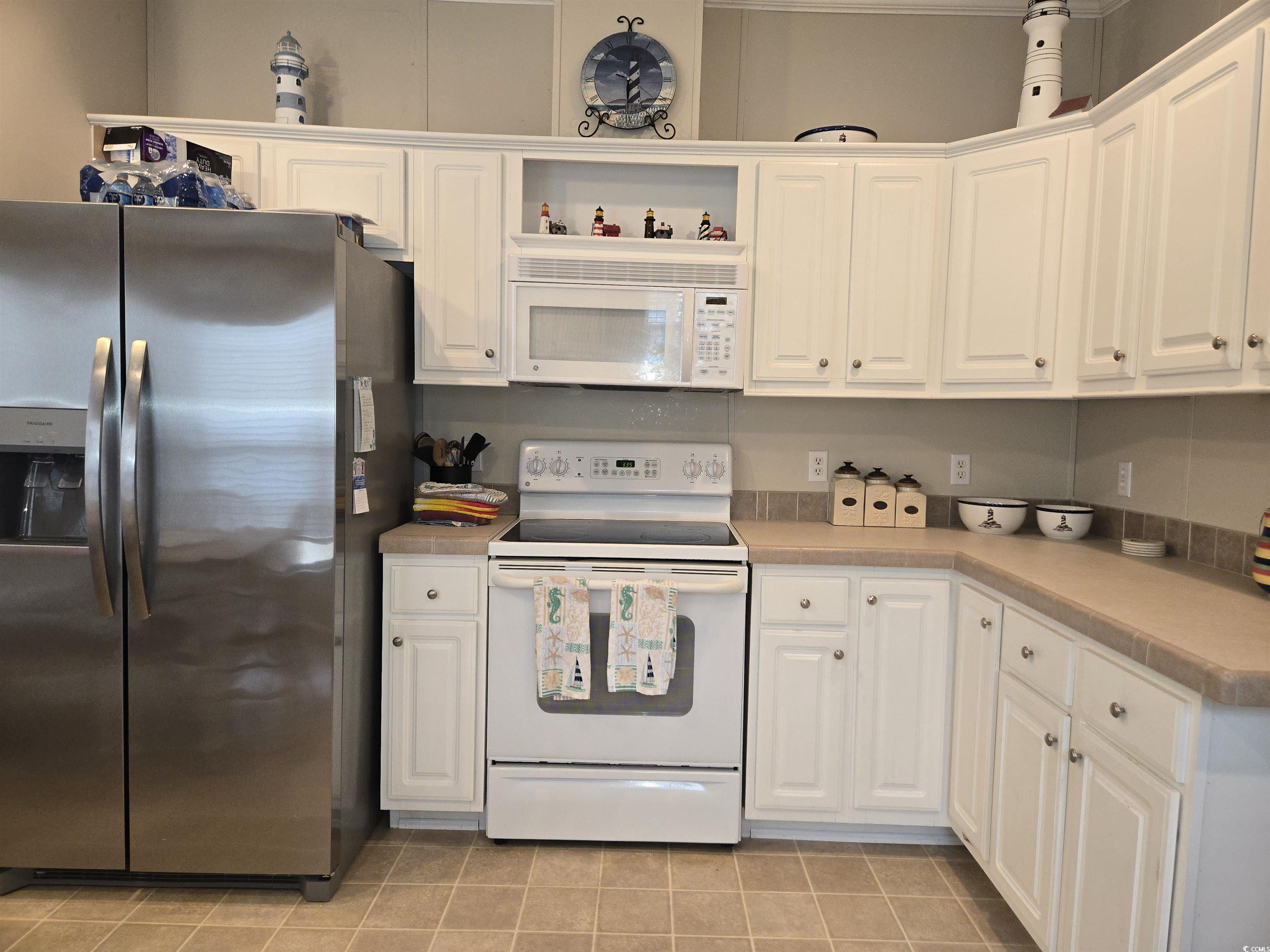 361 East Canal Street Murrells Inlet, SC 29576 - Photo 11 of 35 Kitchen featuring white cabinetry, white appliances, and open shelves