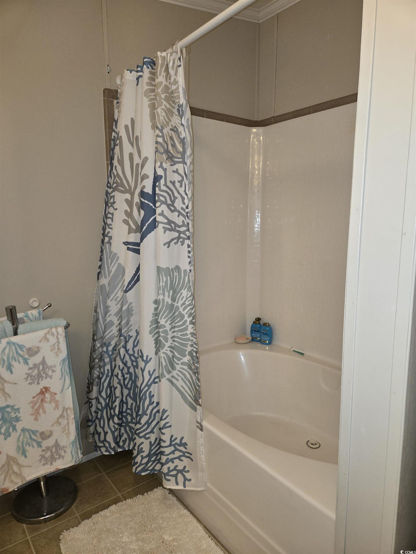 361 East Canal Street Murrells Inlet, SC 29576 - Photo 19 of 35 Full bath with tile patterned floors and shower / tub combo with curtain