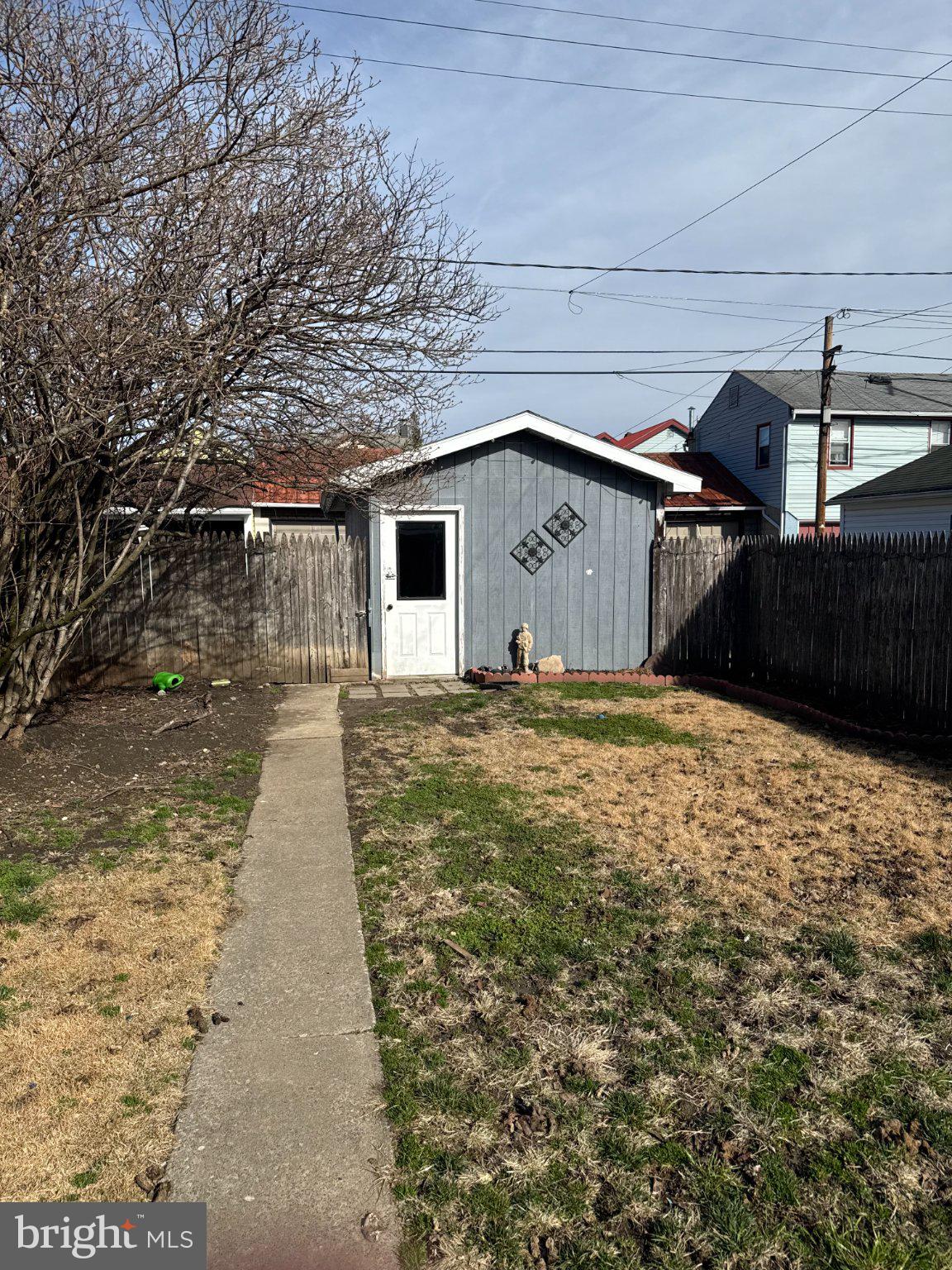 1319 Washington Street Huntingdon, PA 16652 - Photo 3 of 20 Charming backyard with a cozy shed.
