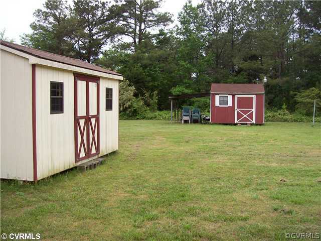8911 Stagg Run Road Charles City, VA 23030 - Photo 3 of 12 Exterior Back - 2 STORAGE BUILDINGS AND CARPORT CO