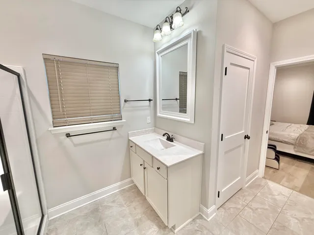a bathroom with a bathtub and shower