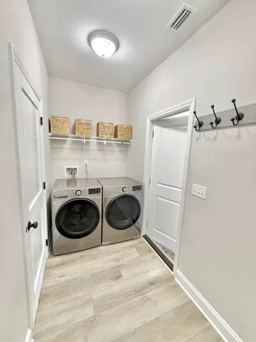 a view of a livingroom with wooden floor