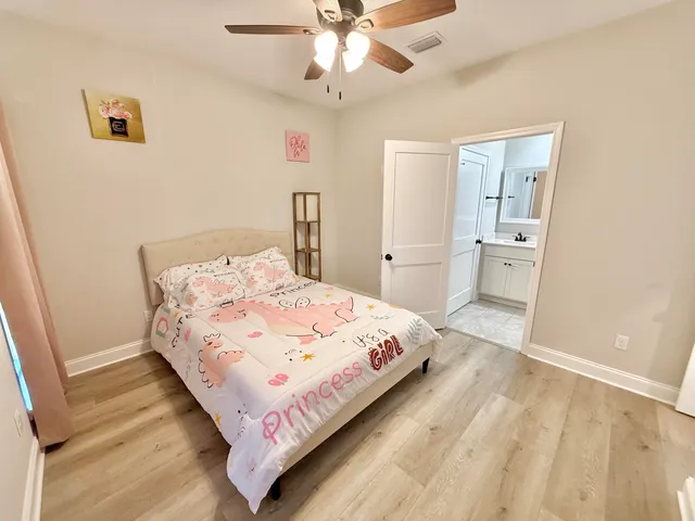a bathroom with a double vanity sink a mirror and a shower