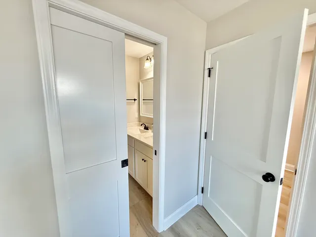 a bathroom with a double vanity sink and mirror