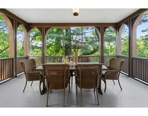 45 The Ledges Road Newton, MA 02459 - Photo 14 of 34 a view of a dining room with furniture large windows and wooden floor