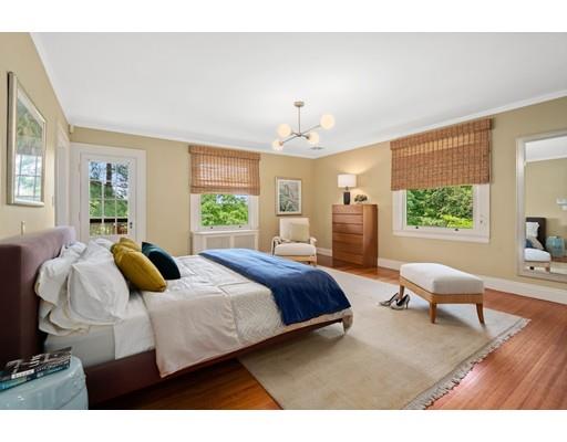 45 The Ledges Road Newton, MA 02459 - Photo 16 of 34 a bedroom with a bed and wooden floor