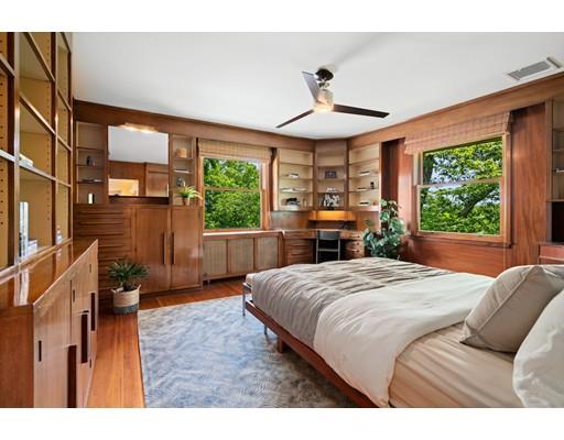 45 The Ledges Road Newton, MA 02459 - Photo 21 of 34 a bedroom with a large bed and a large window