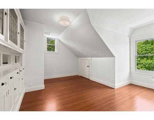 45 The Ledges Road Newton, MA 02459 - Photo 24 of 34 a view of an empty room with wooden floor and a window