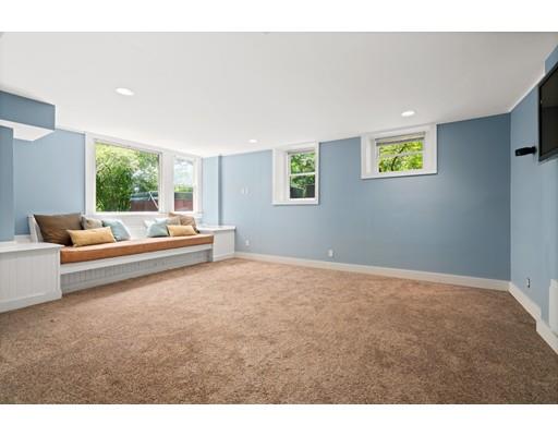 45 The Ledges Road Newton, MA 02459 - Photo 29 of 34 a living room with furniture and a large window