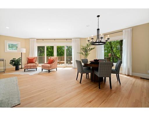 45 The Ledges Road Newton, MA 02459 - Photo 5 of 34 a view of a dining room and livingroom with furniture wooden floor a chandelier