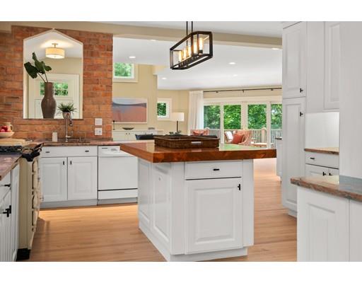 45 The Ledges Road Newton, MA 02459 - Photo 9 of 34 a kitchen with stainless steel appliances granite countertop a stove a sink and a microwave