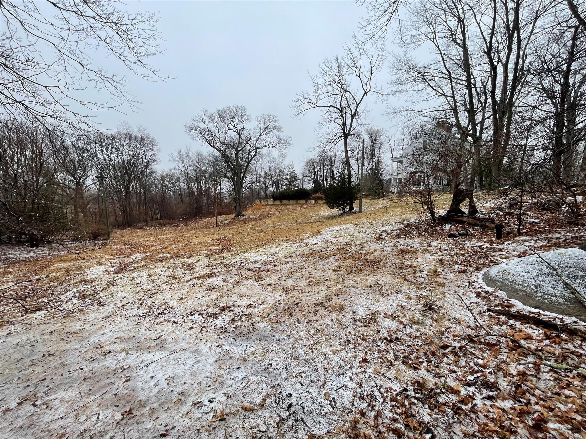 326 A River Road St. James, NY 11780 - Photo 6 of 34 a view of dirt field with trees in the background