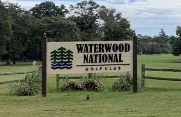 a view of a park that has sign board