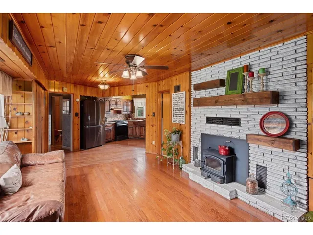 a view of living room with furniture and a fireplace
