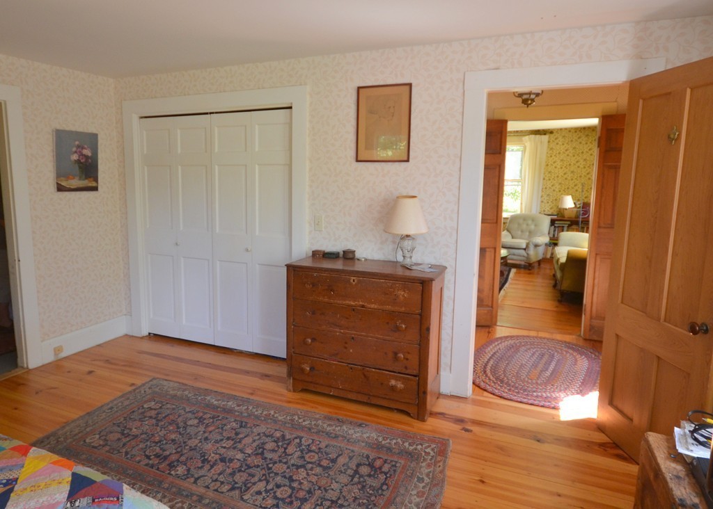 712 Pratt Corner Road Shutesbury, MA 01002 - Photo 13 of 30 a bedroom with a rug and a dresser