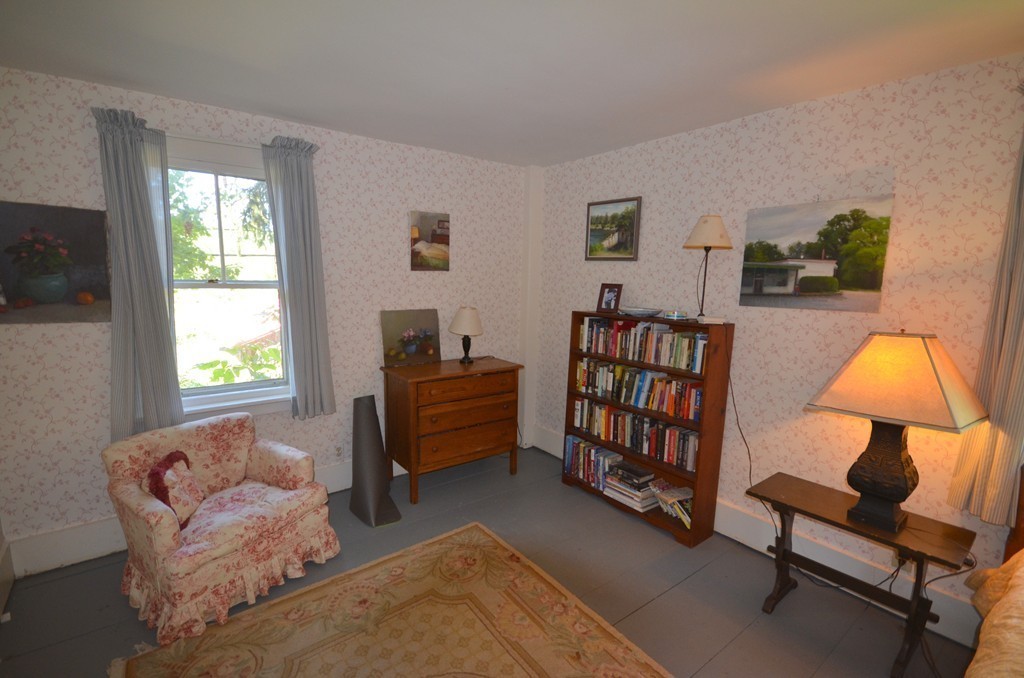 712 Pratt Corner Road Shutesbury, MA 01002 - Photo 15 of 30 a bedroom with furniture and a window