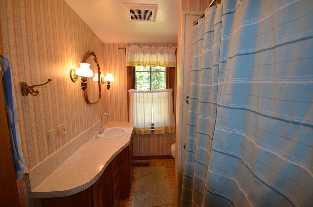 712 Pratt Corner Road Shutesbury, MA 01002 - Photo 16 of 30 a bathroom with a tub a sink and shower