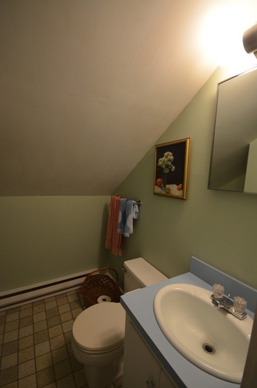 712 Pratt Corner Road Shutesbury, MA 01002 - Photo 20 of 30 a bathroom with a sink mirror and toilet