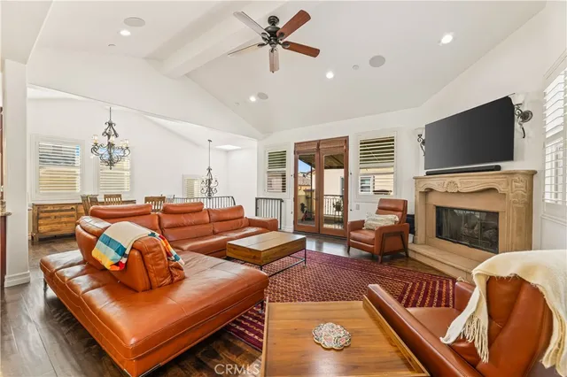 a living room with fireplace furniture and a flat screen tv