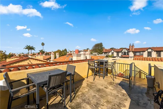 a view of a chairs and table in the patio