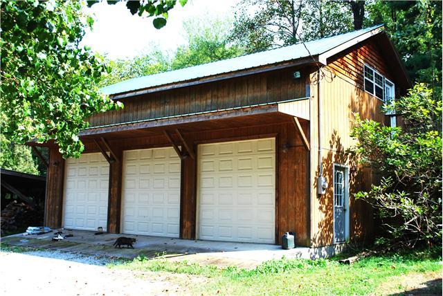 170 Tate Road Sewanee, TN 37375 - Photo 4 of 20 3 car garage with rear access full size garage door for ventilation or to bring the tractor into sheltered work space. Above is an unfinished 1000 sqft plus area with outside entrance, guest room, rental, caretaker or art studio.
