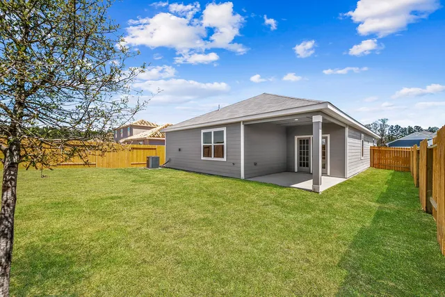 a house view with a backyard space