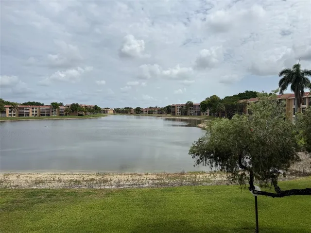 a view of a lake with houses in the background