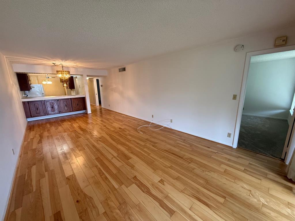6215 Coral Lake Drive, Unit 203 Margate, FL 33063 - Photo 11 of 46 a view of empty room with wooden floor