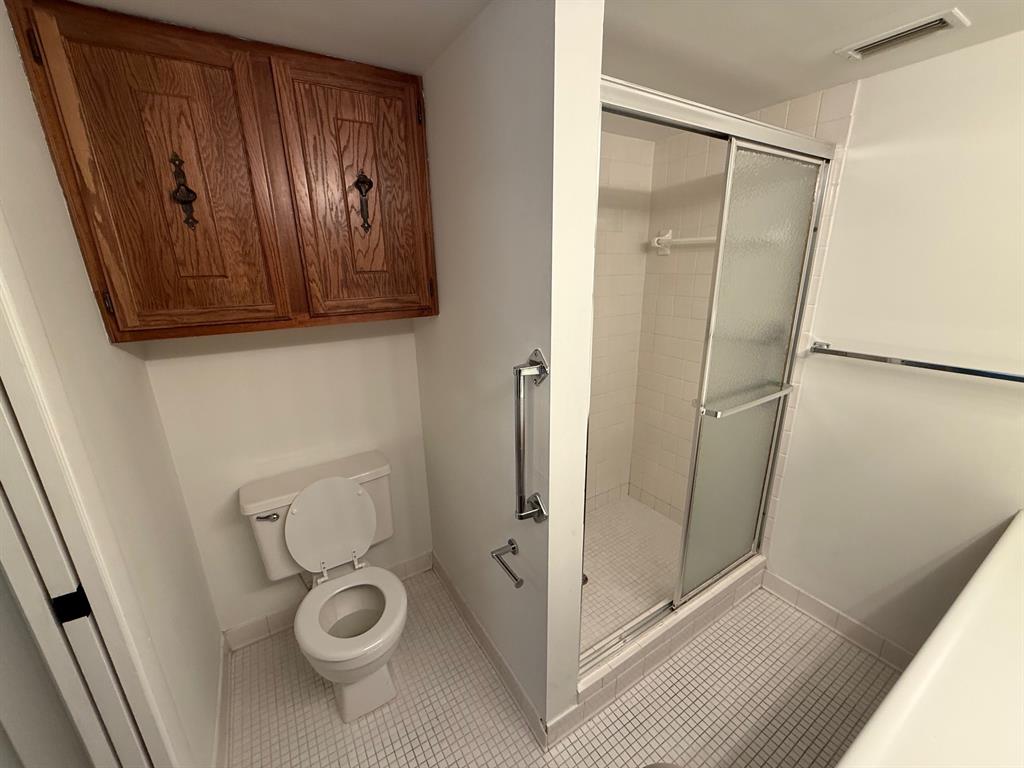 6215 Coral Lake Drive, Unit 203 Margate, FL 33063 - Photo 18 of 46 a bathroom with a toilet and a shower