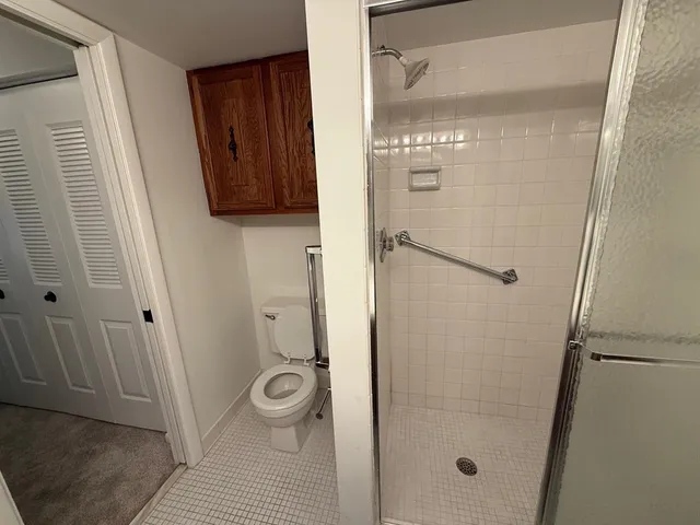 a bathroom with a shower and a sink