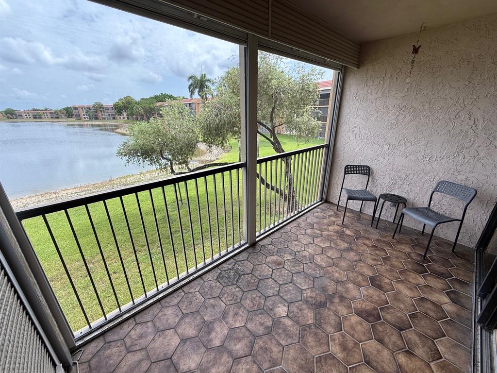 6215 Coral Lake Drive, Unit 203 Margate, FL 33063 - Photo 25 of 46 a view of balcony with furniture