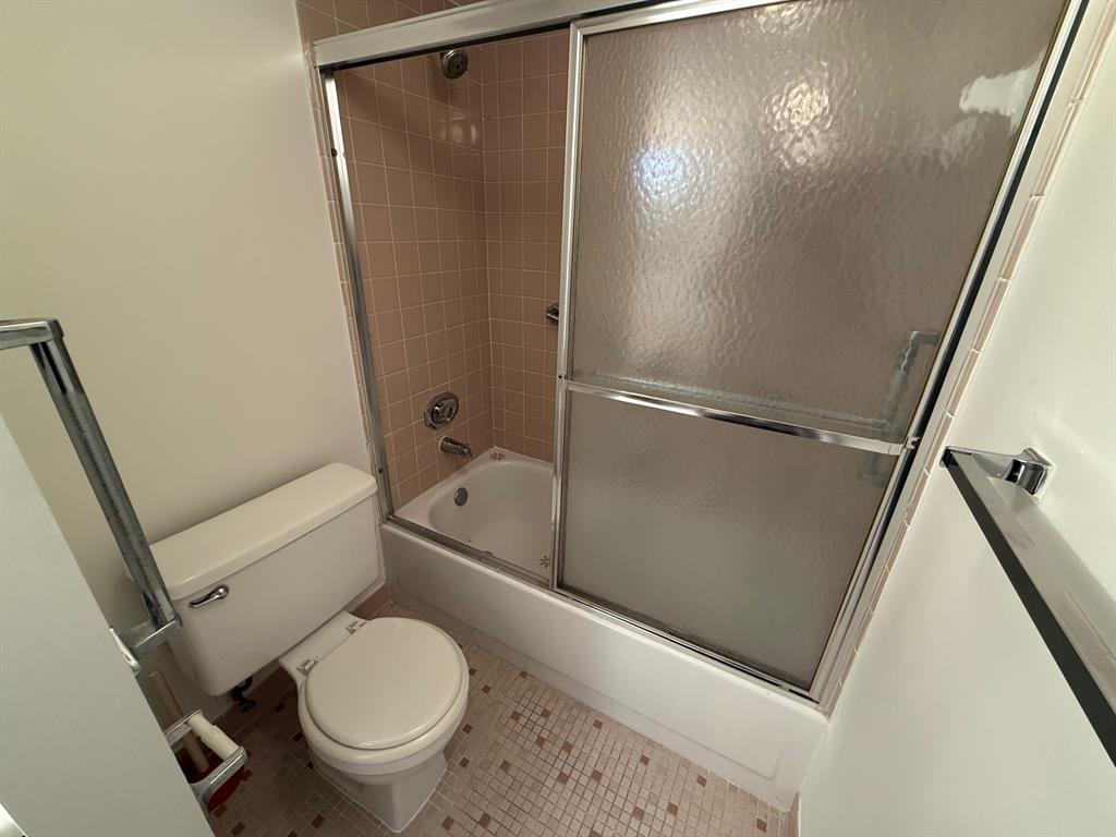 6215 Coral Lake Drive, Unit 203 Margate, FL 33063 - Photo 32 of 46 a white toilet sitting next to a shower