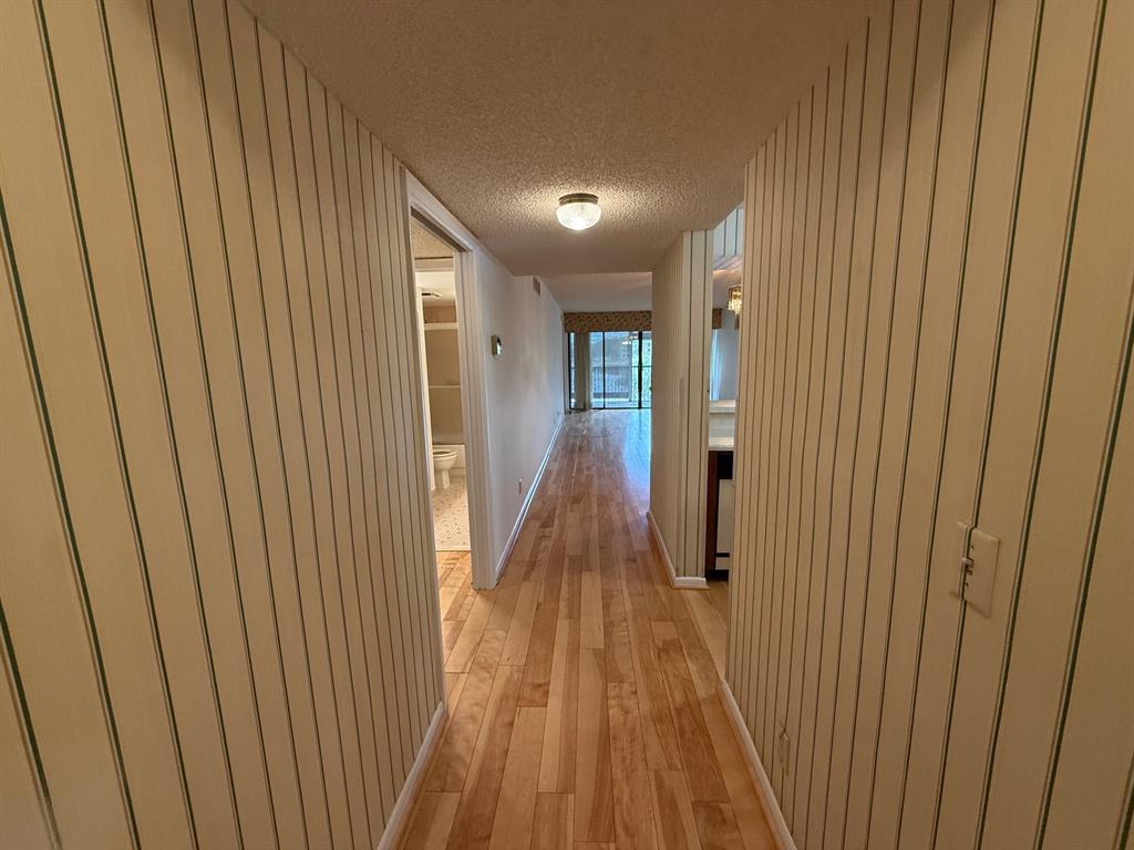 6215 Coral Lake Drive, Unit 203 Margate, FL 33063 - Photo 34 of 46 a view of a hallway with wooden floor