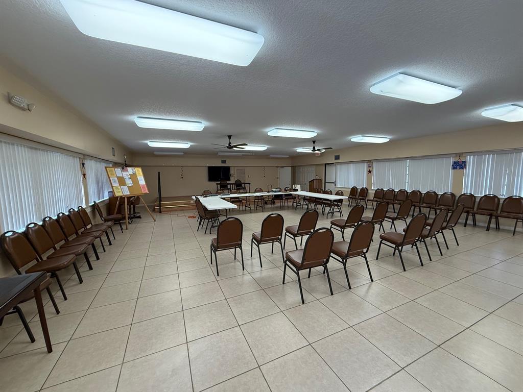 6215 Coral Lake Drive, Unit 203 Margate, FL 33063 - Photo 43 of 46 a group of people sitting in a room with chairs