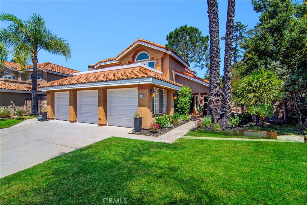 951 Firestone Circle Simi Valley, CA 93065 - Photo 1 of 41 a front view of a house with a yard and porch