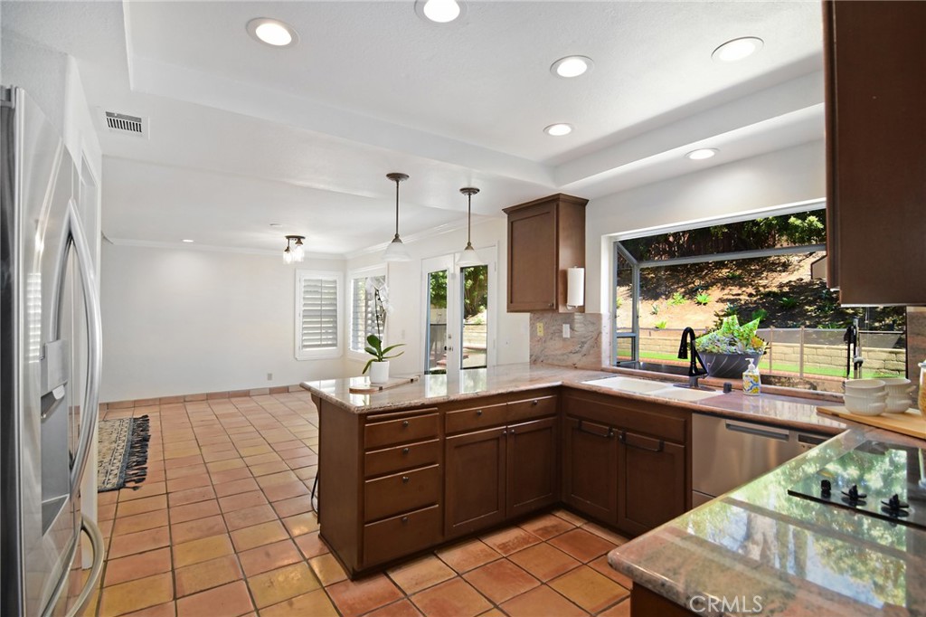 951 Firestone Circle Simi Valley, CA 93065 - Photo 15 of 41 a kitchen with a sink a counter and cabinets