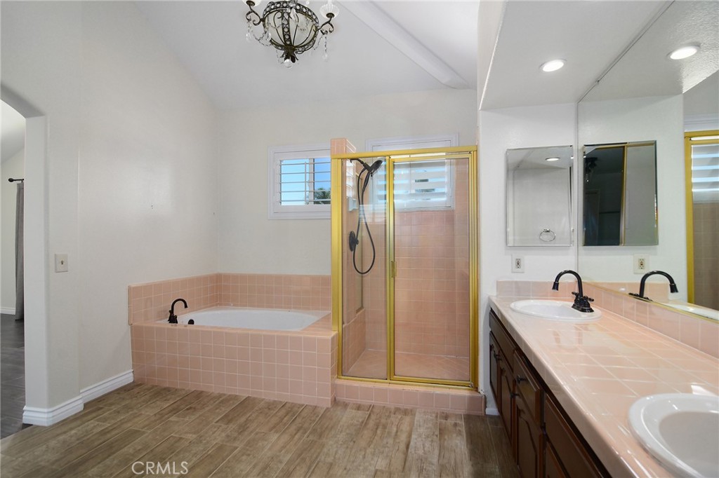 951 Firestone Circle Simi Valley, CA 93065 - Photo 23 of 41 a bathroom with a tub sink and mirror